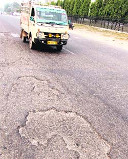 A road full of potholes in Bathinda.