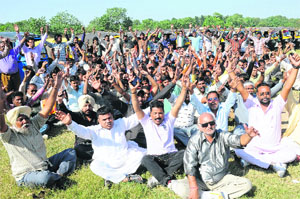 Auto-rickshaw operators raise slogans at the Sector 25 rally ground in Chandigarh on Sunday