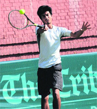 Krishna Rajput returns a shot during a match at the CLTA, Chandigarh, on Sunday.