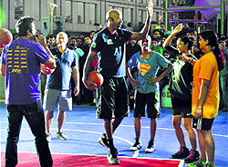NBA legend Bruce Bowen shares a moment with youngsters at a promotional event in Gurgaon on Sunday
