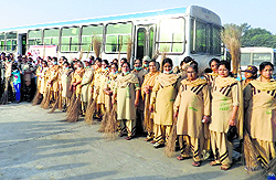 Volunteers of Dera Sacha Sauda gather to clean the bus stand in Sirsa on Sunday