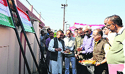 Forest Minister Dinesh Aggarwal lays the foundation stone of a concrete road at Chaman Vihar area in Dehradun on Sunday