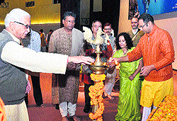Participants light a traditional lamp at the conclusion of the two-day national seminar on Journalism at Dev Sanskriti University in Haridwar