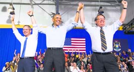 US President Barack Obama with US Senate candidate Gary Peters (R) and candidate for Michigan Governor Mark Schauer (L) at a Democratic campaign rally in Detroit.