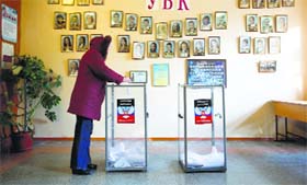 A woman votes during the self-proclaimed Donetsk Peoples Republic leadership and local parliamentary elections at a polling station in Donetsk on Sunday.