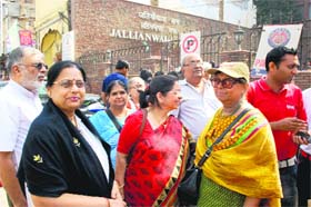A group of tourists from Maharashtra gather outside the Jallianwalla Bagh in Amritsar on Monday