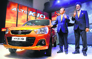 Maruti Suzuki MD Kenchi Ayukawa, (L) and executive director (marketing & sales) RS Kalsi at the launch of Alto K10 in New Delhi on Monday. The manual petrol variants of Alto K10 are priced between Rs 3.06 lakh and Rs 3.56 lakh (ex-showroom price). 