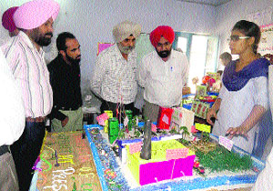 A student explains the functioning of her model during the district-level science exhibition at Guru Nanak Dev Public School in Bathinda on Monday.