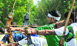 Archers in action during the Panjab University Inter-College Archery Championship at the PU sports ground in Chandigarh on Monday. Tribune photo: Pradeep Tewari