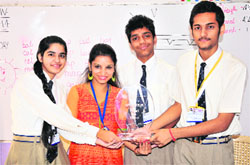 The proud winners with the trophy. Tribune photo: S Chandan