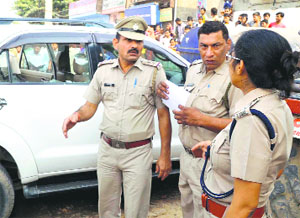 Police officials at the scene of  the crime.