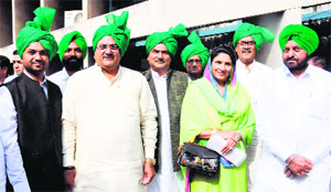 Ajay Chautala with his wife Naina Singh and INLD MLAs at the Assembly on Monday.