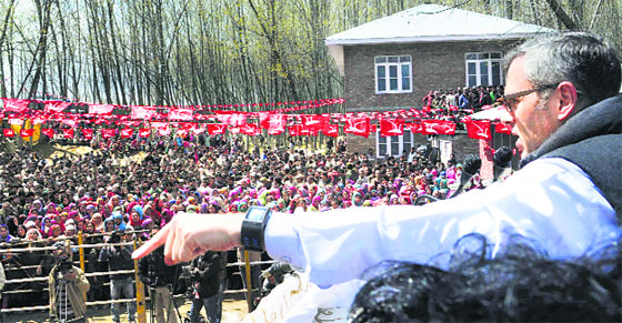 Chief Minister Omar Abdullah addresses a National Conference election rally on the outskirts of Srinagar. Tribune File Photograph
