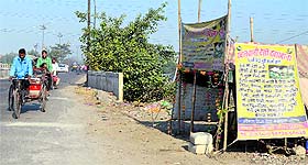 The makeshift shop of a roadside quack.