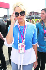 Actress Pamela Anderson arrives in the pit area at the Circuit of the Americas track in Austin, Texas