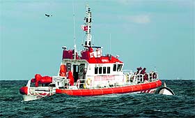 Rescuers retrieve a boat that sank off the Black Sea village of Garipce near Istanbul on Monday. 