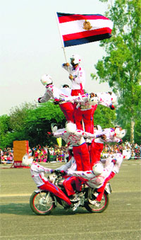 Motorcyclists of the Shvet Ashva team of the Army perform stunts in Bathinda on Tuesday