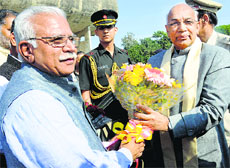 Chief Minister Manohar Lal Khattar (left) welcomes Governor Kaptan Singh Solanki at the Vidhan Sabha in Chandigarh on Tuesday.