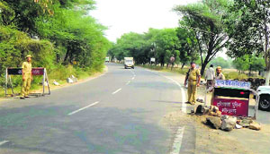 A naka set up at Ateli town in Mahendragarh after undertrials escaped from police custody. 