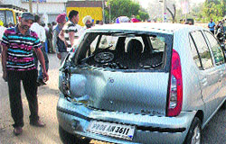 The damaged car after the collision with the bus of St Thomas School in Jalandhar on Tuesday. 