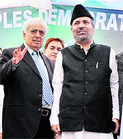 Mufti Mohammad Sayeed with senior PDP leader Muzaffar Hussain Baig at a public meeting in Jammu. 