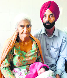 Gurmeet Kaur with her husband and child.