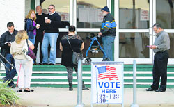 Voters wait for the doors to open at a polling station in St Petersburg on Tuesday. AFP
