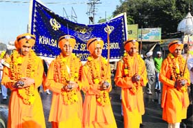 Students dressed up as Panj Piaras participate in Nagar Kirtan
