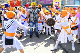 Youth perform gatka during Nagar Kirtan taken out on the birth anniversary of Guru Nanak Dev in Amritsar on Wednesday