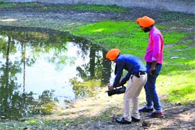 Participants film a clip during the environment and wildlife film festival at Guru Nanak Dev University in Amritsar on Wednesday