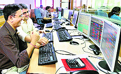 A trader in Mumbai reacts after Sensex crossed the 28,000 mark on Wednesday