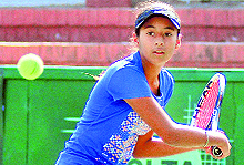 Khushbeen Kaur in action during a girls singles (U-18) quarterfinal tie at the CLTA, Sector 10, on Wednesday. She won the match in straight sets