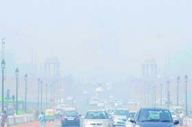 Fog covers the city and reduces the visibility at Rajpath, India Gate, in New Delhi on Wednesday