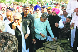 Former Chief Minister Bhupinder Singh Hooda at the Taraori grain market on Wednesday. TRIBUNE PHOTO