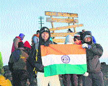 Capt Atul Chandra (right) atop the 5,895 m Uhuru peak at Mount Kilimanjaro in Tanzania.