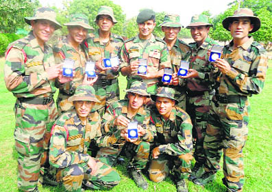 The winners display their medals