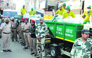 The anti-riot police deployed at Rainak Bazaar during the implementation of the Solid Waste Management Project in Jalandhar on Wednesday.