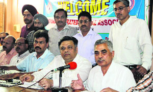 Representatives of the National Integrated Medical Association (NIMA) address mediapersons in Jalandhar on Wednesday.