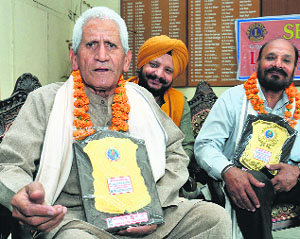 Ex-servicemen Madan Singh Rana and Gopal Krishan after donating their bodies in Jalandhar on Wednesday.