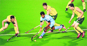 Manpreet Singh is crowded by Australian players during their second match of the four-Test series in Perth on Wednesday.