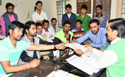 Members of the ABVP submit a memorandum to the District Education Officer at Mayur Vihar in Dehradun on Wednesday. Tribune photo: Abhyudaya Kotnala