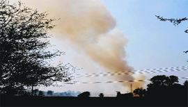 Thick smoke rises from the burning stubble on the outskirts of Bathinda on Thursday.