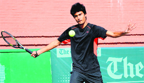 Krishna Rajput in action during a tennis match at the CLTA courts in Chandigarh on Thursday.