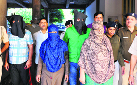 The accused in police custody.