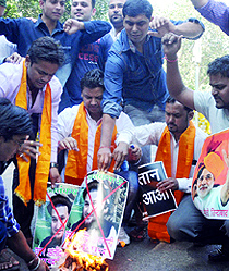 Activists of the Hindu Sena raise anti-Pakistan slogans during a demonstration to protest against the threat to Prime Minister Narendra Modi given by a terrorist group involved in Wagah blast, at Jantar Mantar in New Delhi on Thursday