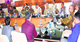 Director General of Police K Rajendra Kumar takes stock of election preparedness at the police headquarters in Jammu on Thursday.