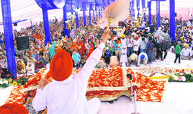 Devotees celebrate the birth anniversary of Guru Nanak Dev at a gurdwara in Jammu on Thursday.