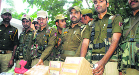 The police show fake currency notes seized in Jammu on Thursday.