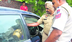 Policemen inspect the crime scene.