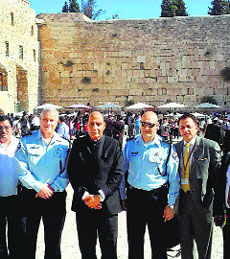 Union Home Minister Rajnath Singh flanked by officials in front of the Western Wall in Jerusalem on Thursday.